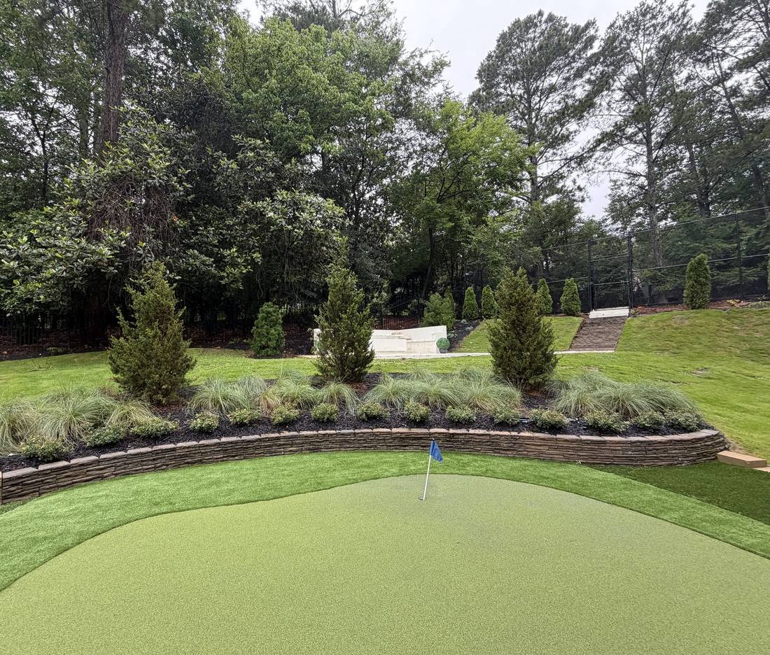 Curved stone wall around a putting green