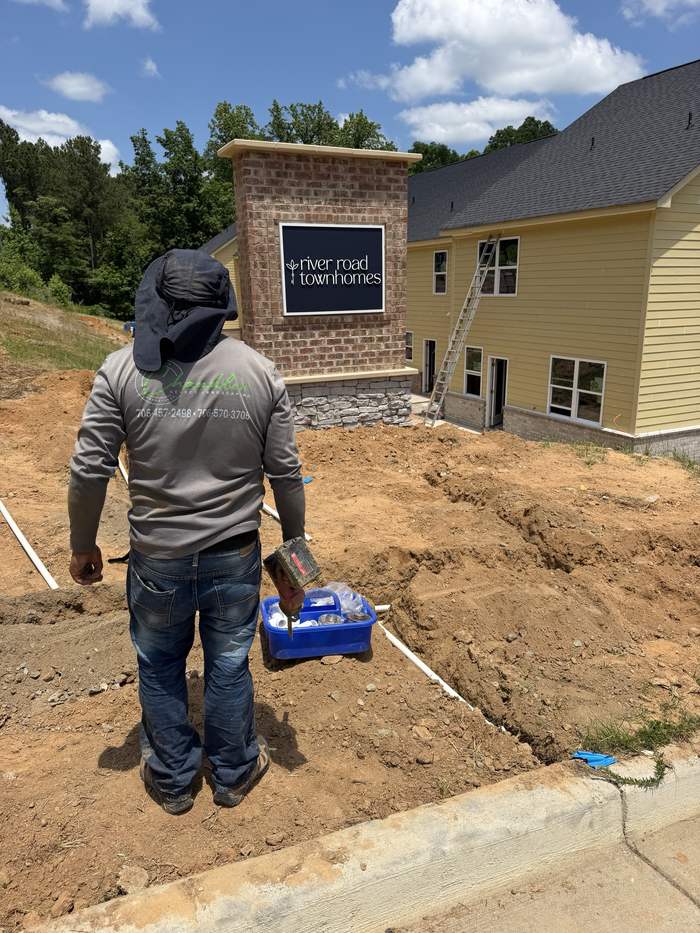 Chandler Select crew laying irrigation main at River Road Townhomes