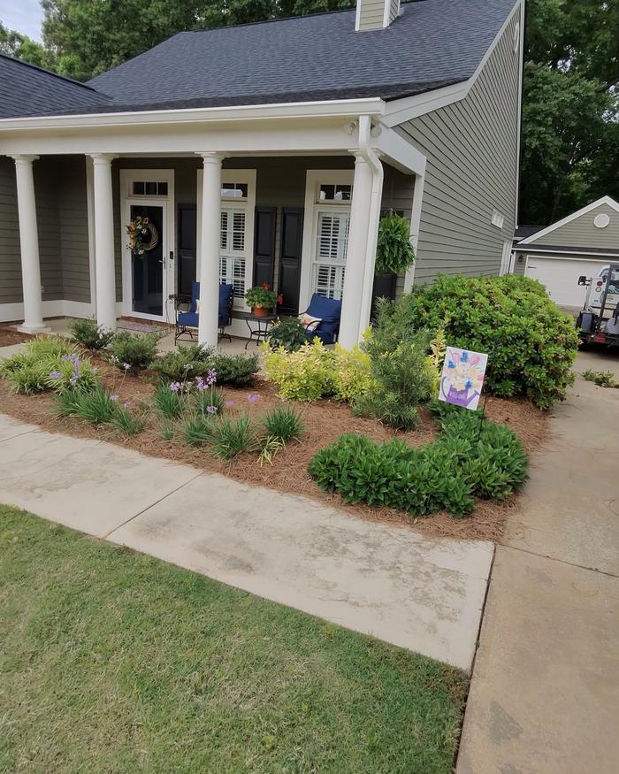 Front porch foundation beds with pine straw