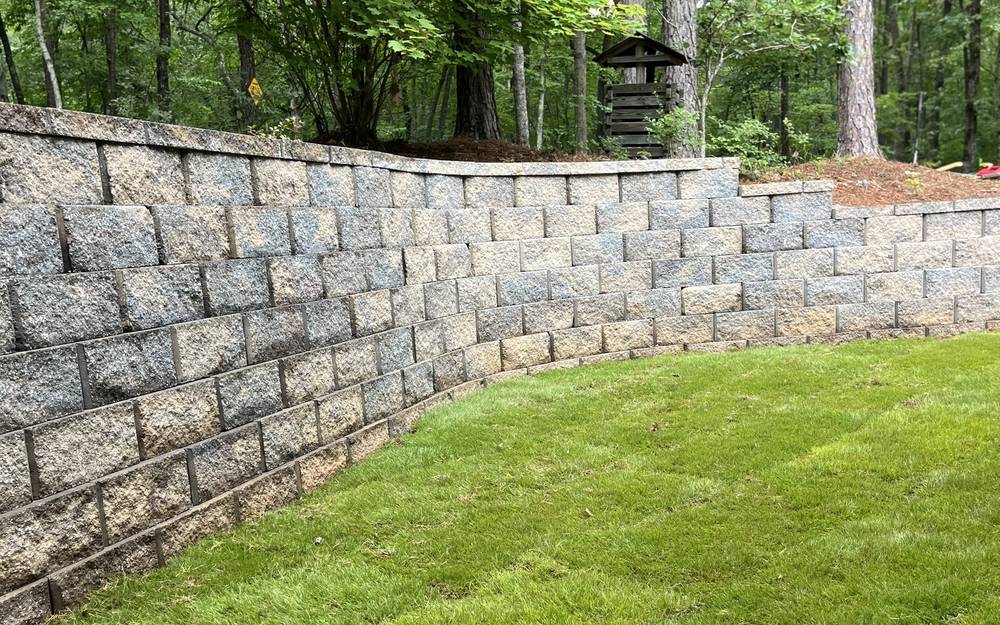 Finished curved retaining wall with sod