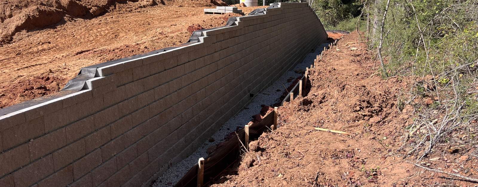Tall segmental block retaining wall on a commercial site