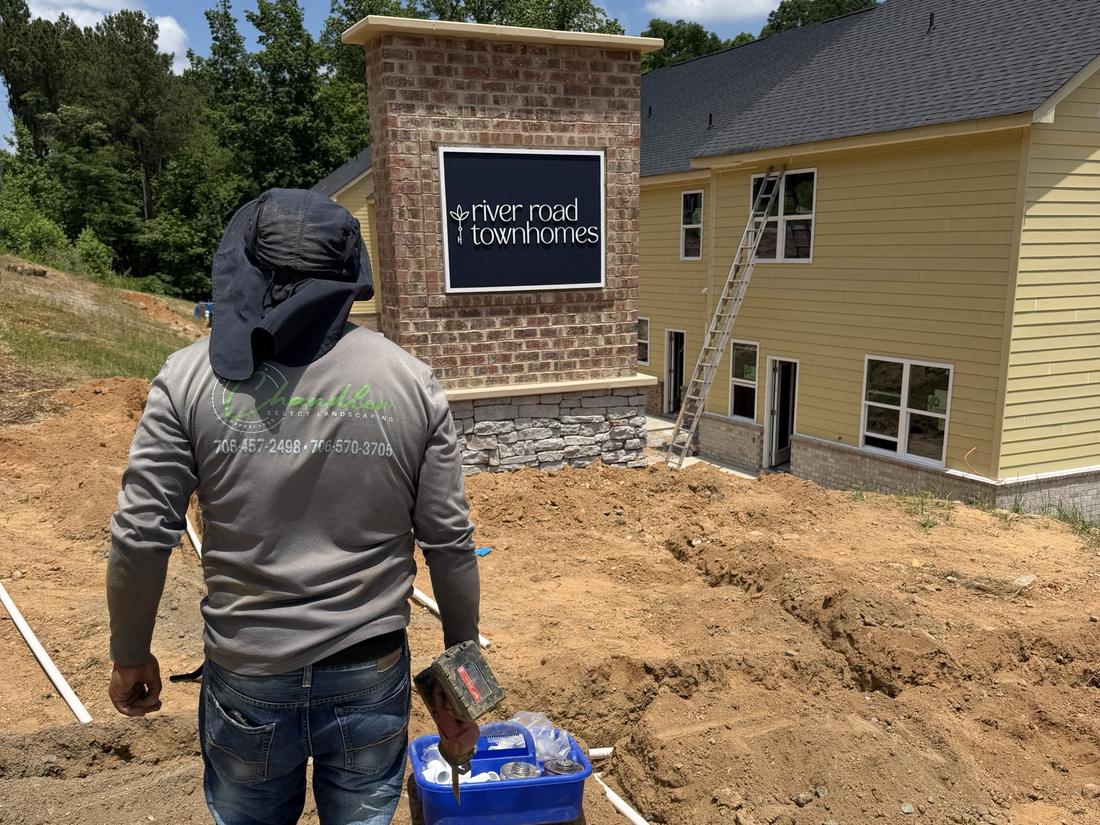 Chandler Select crew laying irrigation main line at River Road Townhomes
