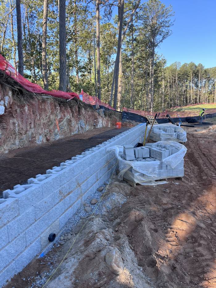 Commercial wall with geogrid laid behind block