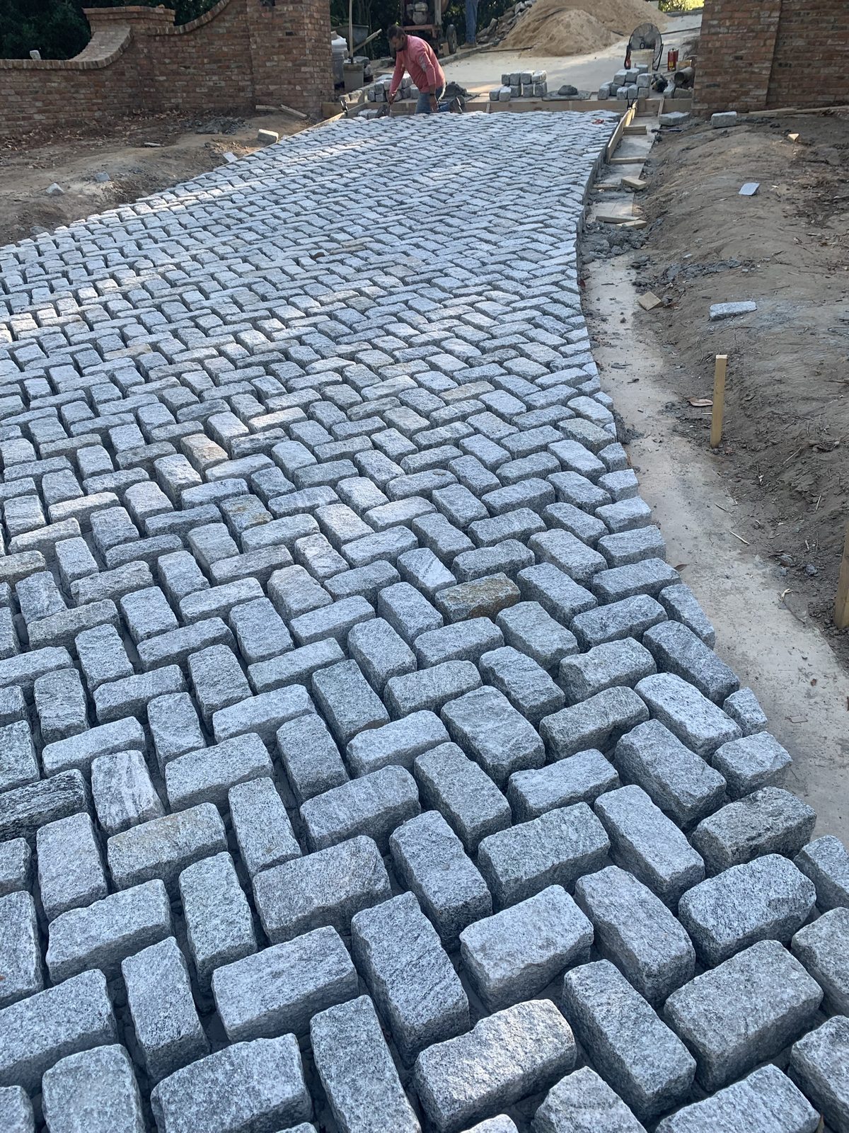 Granite cobblestone driveway in herringbone